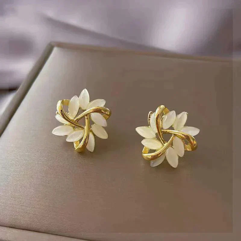 Luxury Earrings of White Opal in Gold